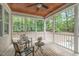 Screened porch with wood ceiling and floors. Outdoor seating area at 297 Curragh Cv, Fuquay Varina, NC 27526