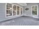 Covered back porch with a gray wood deck and views to backyard at 3004 Krogen Ct, Creedmoor, NC 27522