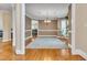 Formal dining room with hardwood floors features a decorative chandelier and a large area rug at 3004 Krogen Ct, Creedmoor, NC 27522