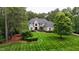 Stunning brick home with meticulously striped lawn and mature landscaping offering great curb appeal at 3004 Krogen Ct, Creedmoor, NC 27522
