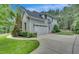 Beautiful two-story home featuring a three-car garage and a well-manicured lawn at 3004 Krogen Ct, Creedmoor, NC 27522