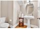 Charming half bathroom features a pedestal sink, decorative mirror and neutral wall color at 3004 Krogen Ct, Creedmoor, NC 27522