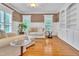 Cozy living room features hardwood floors, bright windows, neutral color palette and built-in shelving at 3004 Krogen Ct, Creedmoor, NC 27522