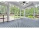 Relaxing screened porch with vaulted ceilings, skylights and views of the lush, private backyard at 3004 Krogen Ct, Creedmoor, NC 27522