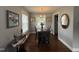 Dining room featuring hardwood floors, grey walls, and decorative lighting at 306 W Canary St, Dunn, NC 28334