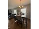 Dining room features hardwood floors, decorative lights, and grey walls at 306 W Canary St, Dunn, NC 28334