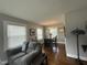 Dining room with grey walls, hardwood floors, and natural light at 306 W Canary St, Dunn, NC 28334