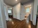 Hallway with hardwood floors that leads to the bedroom and bathroom at 306 W Canary St, Dunn, NC 28334