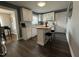 This kitchen has white cabinets, stainless steel appliances, and a center island at 306 W Canary St, Dunn, NC 28334