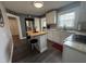 Updated kitchen featuring white cabinetry, butcher block island, and stainless steel appliances at 306 W Canary St, Dunn, NC 28334