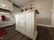 A kitchen island featuring a butcher block countertop, white cabinets, and storage drawers at 306 W Canary St, Dunn, NC 28334