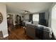 Inviting living room boasts hardwood floors, grey walls, and a ceiling fan at 306 W Canary St, Dunn, NC 28334
