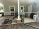 A partially covered patio area, enclosed with chain link fencing and providing space for outdoor storage at 306 W Canary St, Dunn, NC 28334