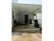 View of the covered patio with an opened door at 306 W Canary St, Dunn, NC 28334