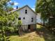 Backyard featuring a wooden staircase and access to the basement at 312 W Front St, Oxford, NC 27565