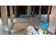 Unfinished basement with exposed beams and wood flooring at 312 W Front St, Oxford, NC 27565