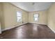 Bright, spacious bedroom with hardwood floors and two windows providing ample natural light at 312 W Front St, Oxford, NC 27565
