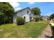 Charming exterior view of a two-story home with a well-maintained lawn and mature trees at 312 W Front St, Oxford, NC 27565