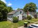Exterior view showcasing a charming two-story home with a classic design and a well-manicured lawn at 312 W Front St, Oxford, NC 27565