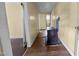 Hallway featuring wood floors and a vintage stove at 312 W Front St, Oxford, NC 27565
