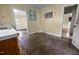 Kitchen area showcasing wood cabinets, sink, and entrances to other rooms at 312 W Front St, Oxford, NC 27565