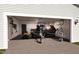 Spacious garage featuring storage for jet skis, bicycles, tools, and lawn care equipment at 331 Bunker Hill Place, Angier, NC 27501