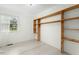 Bright bedroom with light wood floors and built-in shelving at 4021 Chaucer Dr, Durham, NC 27705