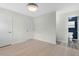 Bedroom with two doors, connecting door to bathroom, window, and hardwood floor at 4021 Chaucer Dr, Durham, NC 27705