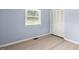 Inviting bedroom with a window, closet and wood floors at 4021 Chaucer Dr, Durham, NC 27705