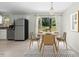 Cozy dining area featuring modern decor and a view of the outdoor deck at 4021 Chaucer Dr, Durham, NC 27705