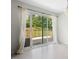 Dining area with sliding glass doors leading to an outdoor deck and yard at 4021 Chaucer Dr, Durham, NC 27705