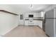 Clean, bright kitchen with white cabinets and modern appliances at 4021 Chaucer Dr, Durham, NC 27705