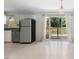 Open kitchen and dining area leading to outdoor deck through sliding glass doors at 4021 Chaucer Dr, Durham, NC 27705