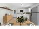 Bright kitchen featuring white cabinets, stainless steel appliances, and a breakfast nook at 4021 Chaucer Dr, Durham, NC 27705