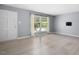 Open and airy living area featuring light hardwood floors and a bright view outside at 4021 Chaucer Dr, Durham, NC 27705