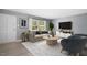 Bright living room featuring modern furniture and a large window, creating an inviting atmosphere at 4021 Chaucer Dr, Durham, NC 27705