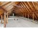 Spacious unfinished attic featuring exposed wooden beams and potential for future customization at 4259 Old Faison Rd, Knightdale, NC 27545