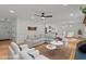 Bright living room featuring hardwood floors, comfortable seating, and an open layout at 4259 Old Faison Rd, Knightdale, NC 27545
