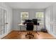 Bright home office with hardwood floors, white walls, and natural light at 4259 Old Faison Rd, Knightdale, NC 27545