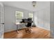 Stylish home office with hardwood floors, white walls, and natural light at 4259 Old Faison Rd, Knightdale, NC 27545