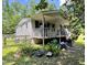 Inviting one-story home with a covered porch, offering a relaxing outdoor space at 4601 Orange Grove Rd, Hillsborough, NC 27278