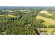 An aerial view of a home site nestled amongst dense trees and beautiful scenery at 4964 Stafford Mill Rd, Liberty, NC 27298