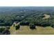 Gorgeous aerial view showcasing the vastness of the property, surrounded by dense forest at 4964 Stafford Mill Rd, Liberty, NC 27298