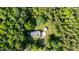 Aerial view of a home surrounded by lush greenery at 4964 Stafford Mill Rd, Liberty, NC 27298