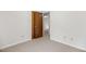 Bedroom with neutral carpet, white walls, and closet with a wood door at 4964 Stafford Mill Rd, Liberty, NC 27298
