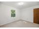Bedroom with neutral carpet, white walls, a window view and ceiling light at 4964 Stafford Mill Rd, Liberty, NC 27298