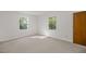 Bright bedroom with neutral carpet, closets and dual bright windows overlooking the yard at 4964 Stafford Mill Rd, Liberty, NC 27298