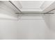 A bright closet features neutral carpet, white walls, shelf and a hanging rod at 4964 Stafford Mill Rd, Liberty, NC 27298