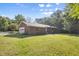 Well-maintained brick home with a green lawn and mature trees at 4964 Stafford Mill Rd, Liberty, NC 27298