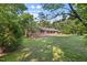 Traditional brick home with covered porch, offering a serene setting and charming curb appeal at 4964 Stafford Mill Rd, Liberty, NC 27298